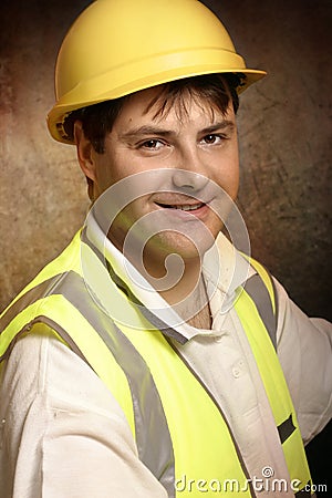 Confident builder in work clothes smiling Stock Photo