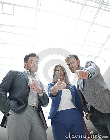 Confident business colleagues showing for you Stock Photo