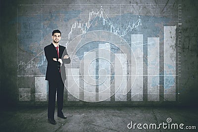 Confident business leader with finance graph Stock Photo