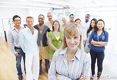 Confident Business Team with their Leader in Front Stock Photo