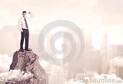 Confident businessman on dangerous cliff Stock Photo