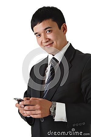 Confident businessman holding cell phone Stock Photo