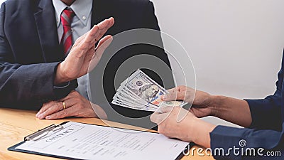 Confident businessman manager rejecting an offer of money to agreement contract from partner or refusing to take bribe, Bribery Stock Photo