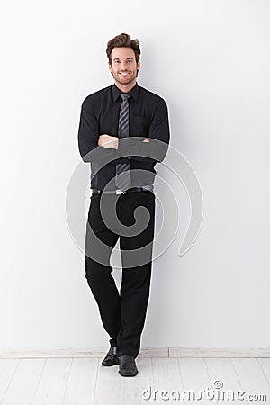 Confident businessman smiling arms crossed Stock Photo