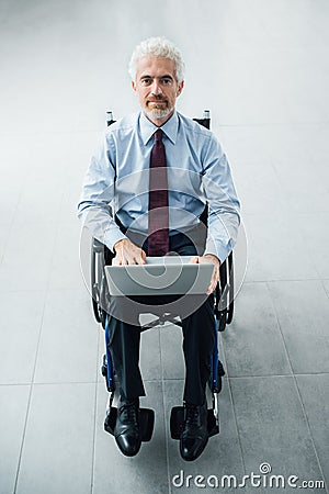 Confident businessman in wheelchair Stock Photo