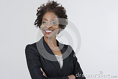 Confident Businesswoman With Arms Crossed Stock Photo