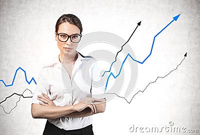 Confident businesswoman in glasses, growing graphs Stock Photo