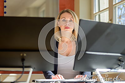 Confident businesswoman or manageress looking at camera Stock Photo