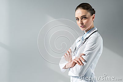 confident female doctor with crossed arms looking Stock Photo