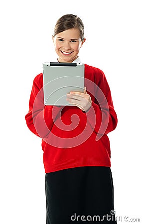 Confident girl using wireless portable device Stock Photo