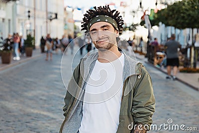 Confident guy with dreadlocks hairstyle, close up portrait, street photo, urban style. Young handsome beard man dressed stylish Stock Photo