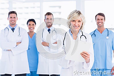 Confident happy group of doctors at medical office Stock Photo