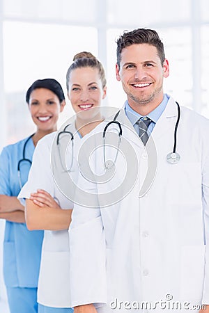 Confident happy group of doctors at medical office Stock Photo