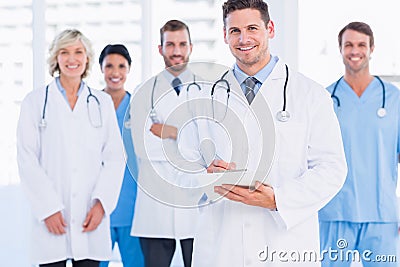 Confident happy group of doctors at medical office Stock Photo