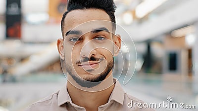 Confident Hispanic Indian Ethnic bearded man millennial 30s male with beard guy businessman looking at camera Stock Photo