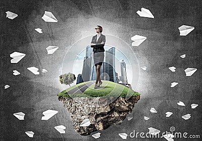 Confident lady boss and modern city as concept of eco green cons Stock Photo