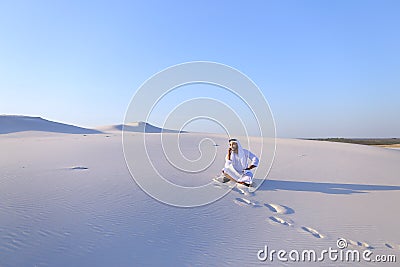 Confident male Emirate builder speaks on cellular with customer, Stock Photo