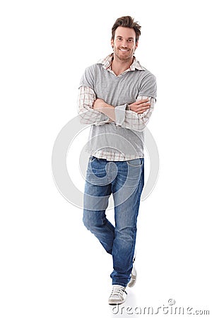 Confident man in jeans smiling Stock Photo