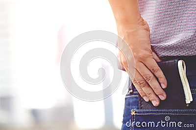 Confident man posing in safe keeping your wallet in the back pocket Stock Photo