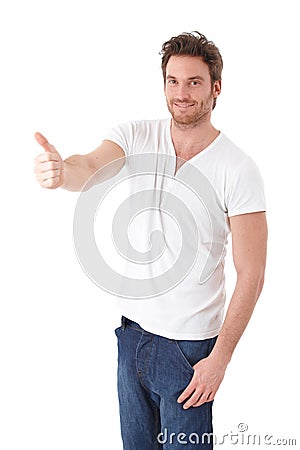 Confident man showing thumb up smiling Stock Photo