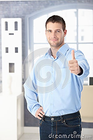 Confident man smiling thumb up Stock Photo