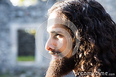 Confident man with unusual appearance stare straight before one. Man style and fashion concept. Close up portrait of Stock Photo