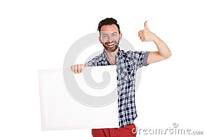 Confident mature man holding blank poster and showing thumbs up Stock Photo