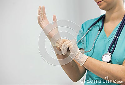 Confident nurse wearing gloves in hospital Stock Photo