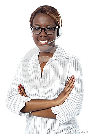 Confident operator lady smiling, wearing headset Stock Photo