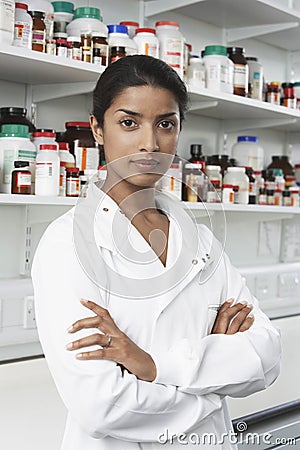 Confident Pharmacist In Pharmacy Stock Photo