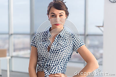 Confident positive young woman posing, smiling. Gorgeous friendly looking brunette girl, standing sideways. Stock Photo