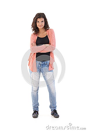 Confident schoolgirl standing arms crossed Stock Photo