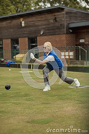 Confident Senior Lawn Bowling Stock Photo