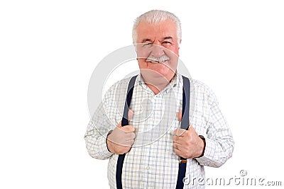 Confident senior man holding his suspenders Stock Photo