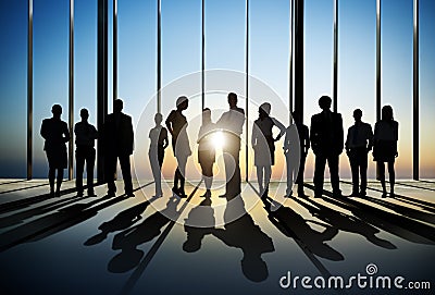 Confident Silhouette Of Business People Posing For The Camera In Stock Photo