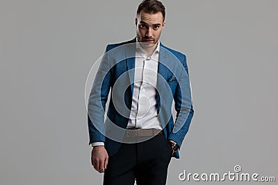 Confident smartcasual model holding hand in pocket Stock Photo