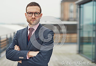 Confident stylish businessman on a balcony Stock Photo