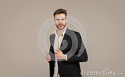 Confident and stylish. sexy ceo on gray background. modern office life. charismatic business owner. stylish realtor Stock Photo