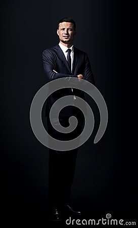 Confident is a successful lawyer in black suit and standing wi Stock Photo
