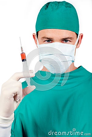 Confident surgeon holding a syringe Stock Photo