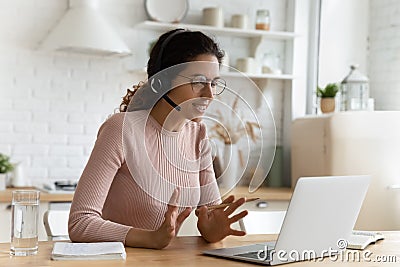 Smart young latin female provide video lesson by home laptop Stock Photo