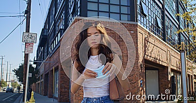 Confident woman wearing mask close up. Responsible girl take care about health. Stock Photo