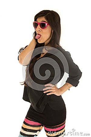 Confident woman wearing sunglasses and colorful leggings Stock Photo