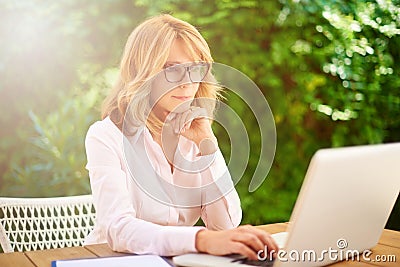 Confident woman working from home Stock Photo