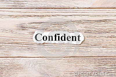 Confident of the word on paper. concept. Words of confident on a wooden background Stock Photo