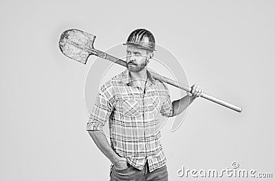 Confident worker. mature builder in shirt. unshaven man on construction site. handsome building worker in hard hat Stock Photo