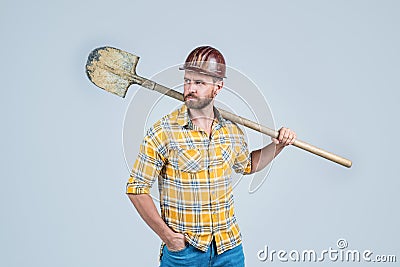 Confident worker. mature builder in shirt. unshaven man on construction site. handsome building worker in hard hat Stock Photo