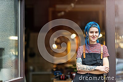 Confident young craftswoman in her workshop Stock Photo