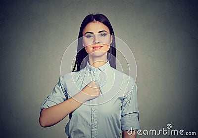 Confident young woman isolated on gray wall background Stock Photo