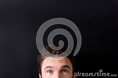 Confident youthful guy is expressing curiosity Stock Photo